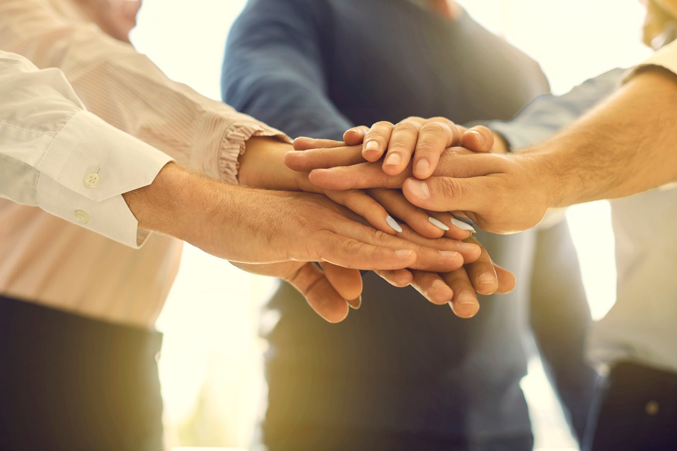 Close up of Business Partners Making Agreement and Confirming Collaboration by Joining Hands